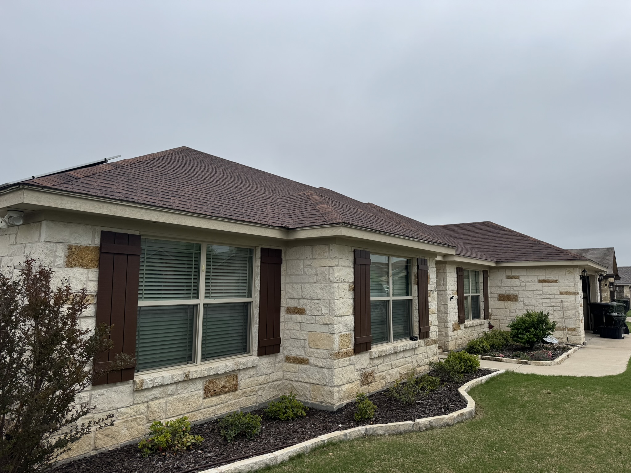 Beautiful Temple Texas home with stone exterior and landscaping